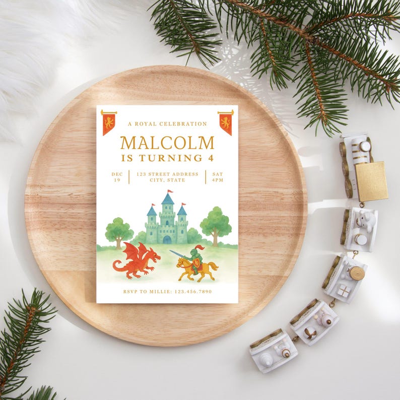 May include: A birthday invitation with a royal theme. The invitation features the text "Malcolm is turning 4" in gold lettering, along with a watercolor illustration of a castle, dragon, and knight. The invitation is on a wooden tray.