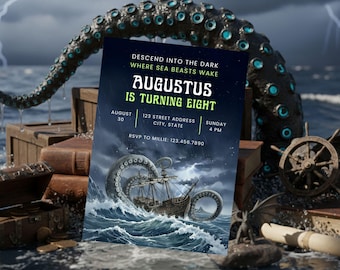 May include: An invitation card with a dark blue background and the text "AUGUSTUS IS TURNING EIGHT". The card features an illustration of a ship being attacked by a giant sea creature. Other elements include a treasure chest, books, and a ship's wheel.