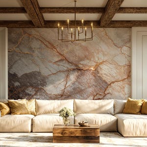 May include: A contemporary living room with a cream-coloured sectional sofa and mustard-coloured cushions. The room features a marble accent wall, a wooden coffee table, and a patterned rug. A chandelier hangs from the wooden beam ceiling.