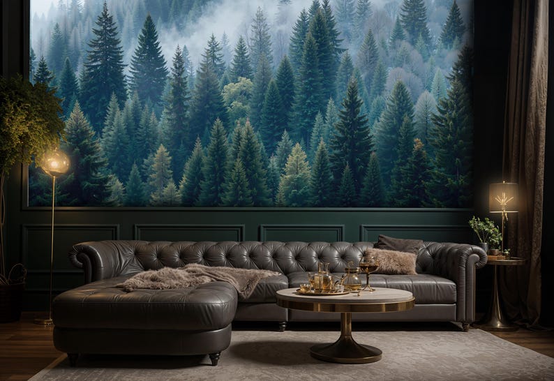 May include: A living room with a forest mural, a dark gray leather sectional sofa, and a round coffee table. The room is decorated with a floor lamp, a side table, and a rug. The overall theme is nature and luxury.
