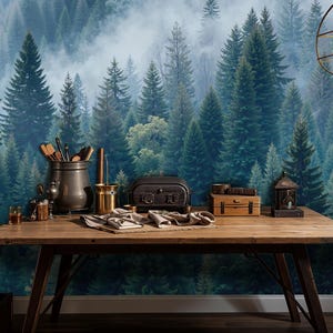 May include: A rustic wooden table displays various items against a forest mural backdrop. Items include a metal pot with utensils, a small stove, a lantern, and a wooden box. A vintage-style lamp and a wooden ladder are also visible.