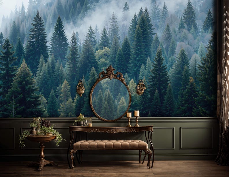 May include: A room with a forest mural wallpaper, a dark wood vanity with a mirror, and a small round table. The vanity has a bench and is decorated with plants and candles. The walls are dark green with white trim.