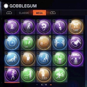 Pode incluir: Uma tela exibindo uma sele&ccedil;&atilde;o de itens "Gobblegum", cada um representado por um &iacute;cone circular com um gr&aacute;fico e um n&uacute;mero exclusivos. A aba "MEGA" est&aacute; destacada. Os &iacute;cones apresentam v&aacute;rias cores e designs, como uma caveira, um rel&oacute;gio e uma pessoa.
