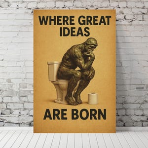 May include: A humorous poster with a cartoon image of a man sitting on a toilet, thinking. The text on the poster reads "Where great ideas are born."
