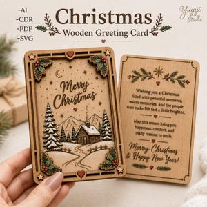 May include: A rectangular wooden greeting card featuring a laser-engraved winter scene with a cabin, pine trees, and mountains, inscribed with Merry Christmas. A second wooden card displays a printed holiday message and Merry Christmas & Happy New Year.