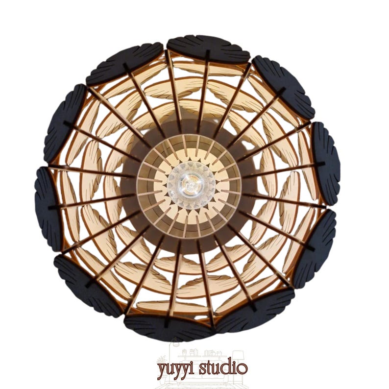 May include: Overhead view of a decorative wooden pendant light fixture. The light features a circular design with a central light bulb, surrounded by layered wooden elements in shades of brown and black. The text "yuyyi studio" is at the bottom.