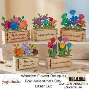 May include: Wooden flower bouquets in decorative wooden boxes. Each box features laser-cut flowers in various colors and a unique message. The bouquets are a Valentine's Day theme.