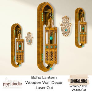 May include: Wooden wall decor set featuring three decorative lanterns and a Hamsa hand. The lanterns are brown with turquoise accents and intricate cut-out designs. The Hamsa hand is a light brown color with a turquoise center. The set is designed for laser cutting.