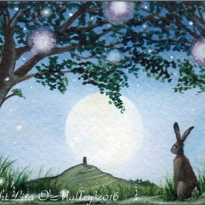 May include: A watercolour painting of a moonlit landscape with a lone rabbit sitting in the foreground. The moon is full and bright, and the sky is filled with twinkling stars. The rabbit is brown and white, and it is looking up at the moon. The painting is set in a forest, and there are trees in the background. The painting is signed "Copyright Lisa O'Malley 2016".