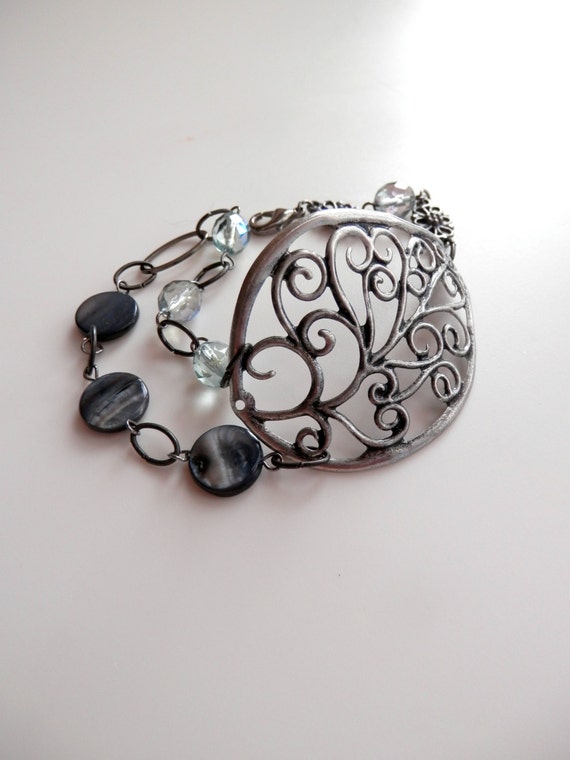 Items similar to Winter Grove - Gunmetal leaf bracelet with swirls ...