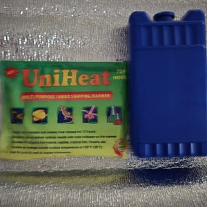 May include: A blue rectangular shipping warmer and a green and red UniHeat multi-purpose jumbo shipping warmer package. The package has illustrations of insects, reptiles, and flowers. The warmer is designed for shipping live insects, reptiles, and tropical fish.