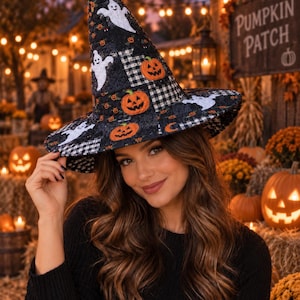 May include: A tall, pointed witch hat featuring a black and white checkered pattern mixed with black fabric panels. The hat is decorated with embroidered white ghost figures and orange jack-o'-lantern pumpkin faces across the entire surface.