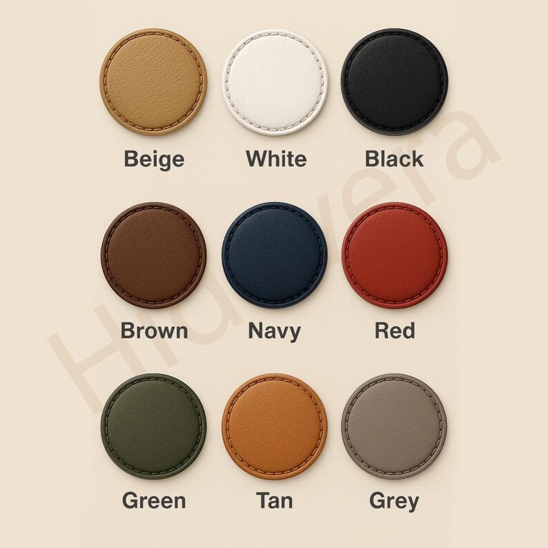 May include: A collection of nine round, leather-like coasters in various colors: beige, white, black, brown, navy, red, green, tan, and grey. Each coaster has a stitched edge and a color-coded label underneath.