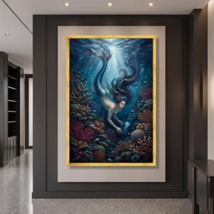 May include: A rectangular wall art piece in a gold frame depicting a mermaid swimming underwater among colourful coral reefs and sea life. The scene features deep blue water, light rays filtering from above, and a small glowing jellyfish.