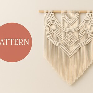 May include: Cream-colored macrame wall hanging with a geometric design, suspended from a natural wooden dowel. The design includes a central diamond shape and flowing lines. The word "PATTERN" is in a red circle.