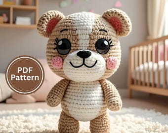 May include: A handmade crochet teddy bear with a tan and white color scheme. The bear has large black eyes, pink cheeks, and a smiling mouth. The image includes a "PDF Pattern" graphic, suggesting a DIY craft project. The bear is standing on a fluffy white rug.