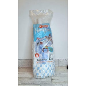 May include: A package of Quickie HomePro Ring-A-Mop Refill. The package is mostly white with a blue and white label. The label has the words "Quickie HomePro" in a stylized font. The text "Ring-A-Mop Refill" is also visible.
