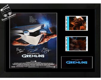 Exhibición de la película original de Gremlins, firmada por el elenco. Increíble pieza de colección. Con certificado de autenticidad.