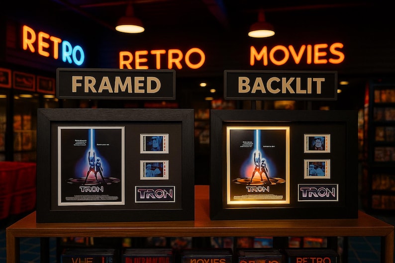 two framed movie posters for the film "Tron" displayed in a store, with neon signs indicating the categories of the store.