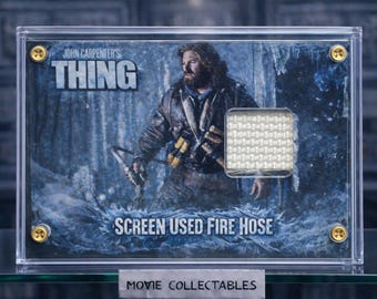 Screen-Used Fire Hose Fragment Display – The Thing (1982) – Movie Prop Memorabilia – Handcrafted Acrylic Collectible with COA