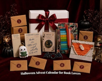 May include: A Halloween advent calendar gift set featuring a white box with a red ribbon, seven numbered kraft paper envelopes, a crochet ghost keychain, a library card print, a Gliminis pin, a colorful sticky note set, and a crochet bookmark.