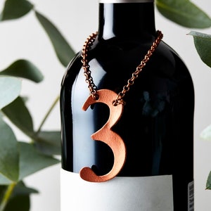 3rd Anniversary bottle tag, a leather number 3 available in copper, silver, gold and rose gold.