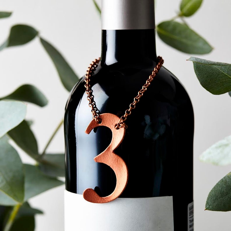 3rd Anniversary bottle tag, a leather number 3 available in copper, silver, gold and rose gold.