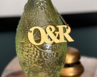 Metallic Couples Initial Leather Anniversary Bottle Tag.