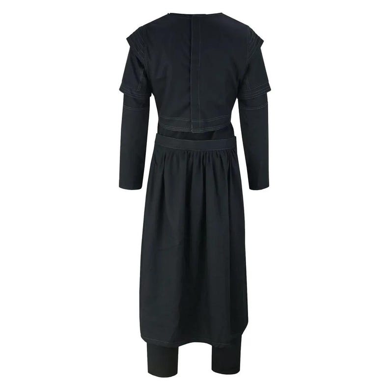 May include: Black two-piece outfit. The top has long sleeves and shoulder detailing, paired with a skirt-like bottom and matching leggings. The back view highlights the stitching and design of the garment.