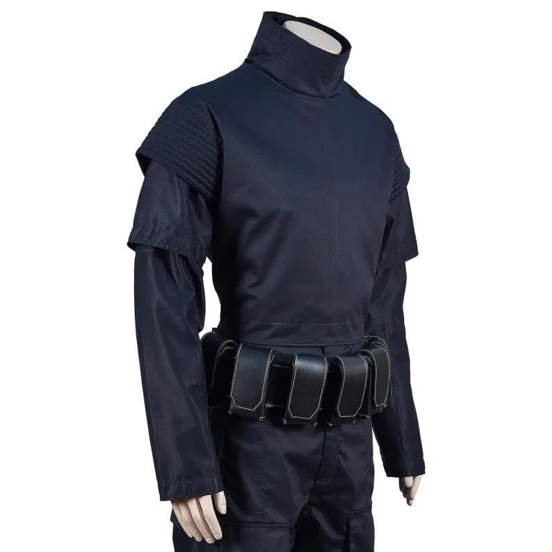 May include: A dark navy blue costume featuring a high collar, shoulder accents, and long sleeves. The costume includes a belt with multiple pouches. The outfit is made of a smooth, possibly synthetic fabric.