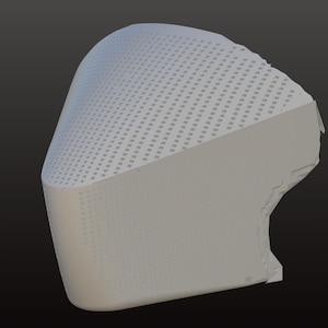 May include: A light grey, curved object with a perforated top surface and a solid, smooth lower section. The design appears to be a 3D rendering or model, possibly for a protective device or architectural element.