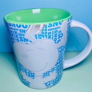 Peanuts Snoopy Mug Blue White Snoopy Graphics Inside Green