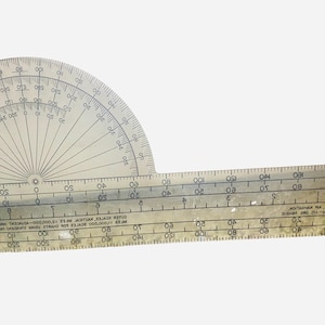 May include: A clear plastic protractor and ruler combination. The protractor is a semi-circle with degree markings from 0 to 180. The ruler has inch and centimeter markings. Ideal for geometry and drafting.