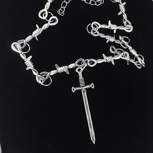 Barbed wire necklace with large sword