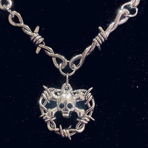 Barbed wire necklace with barbed wire heart and skull
