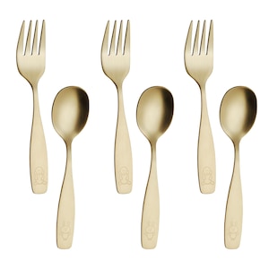 May include: Six-piece gold-colored flatware set, including forks and spoons. Each piece features a small, engraved cartoon bunny at the base of the handle. The utensils have a smooth, matte finish.