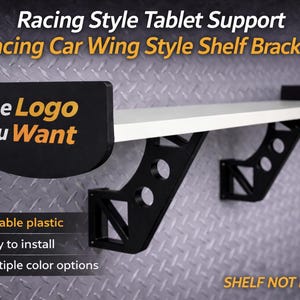 May include: Black and white shelf brackets in a racing car wing style, designed for tablet support. The brackets feature the text "The Logo you Want" and are made of durable plastic. The image also highlights that the brackets are easy to install and offer multiple color options.