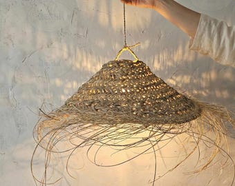 Straw lampshade with pendant light in the style of a parasol