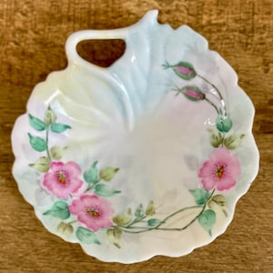 vintage hand painted porcelain vanity tray. floral design and gold rim