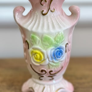 vintage porcelain pastel color vase with floral decoration and gold accents