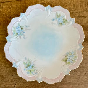 vintage hand painted porcelain dish. floral design with scalloped rim and gold accents