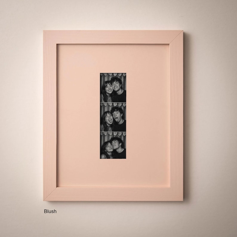 A framed collage of three black and white photographs of a couple, with the central photograph being a close-up of the couple's faces.