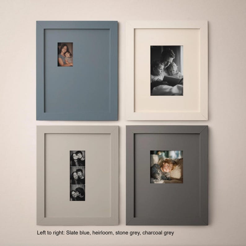 four framed photographs arranged in a grid on a wall.