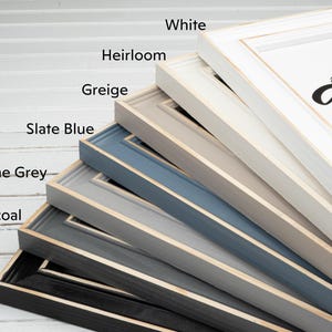 a stack of books labeled in different colors