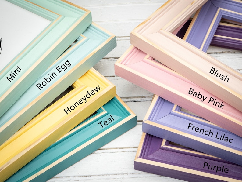 a group of different colored frames sitting on top of a table