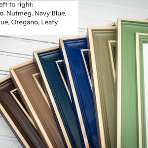 a group of framed pictures sitting next to each other