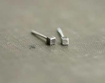 lar mismatched earrings in brushed or blacked