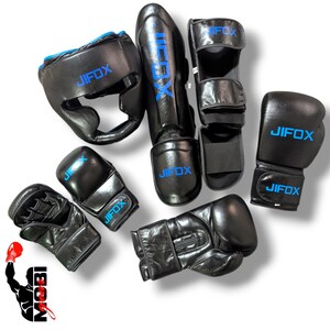 May include: Black boxing and martial arts protective gear set. Includes a head guard, shin guards, foot protectors, and multiple pairs of gloves. The brand name "JIFOX" is printed in blue on each piece of equipment.