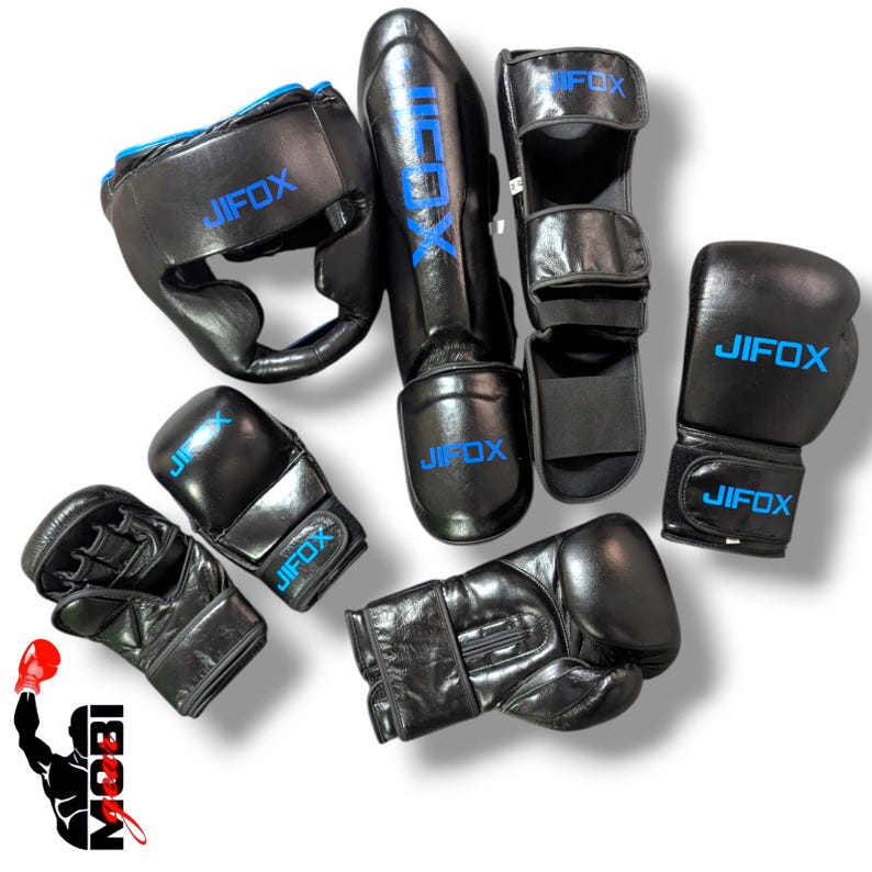 May include: Black boxing and martial arts protective gear set. Includes a head guard, shin guards, foot protectors, and multiple pairs of gloves. The brand name "JIFOX" is printed in blue on each piece of equipment.