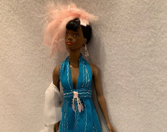 Tonner Esme Wearing  Long Blue Gown accented with Silver and Pink